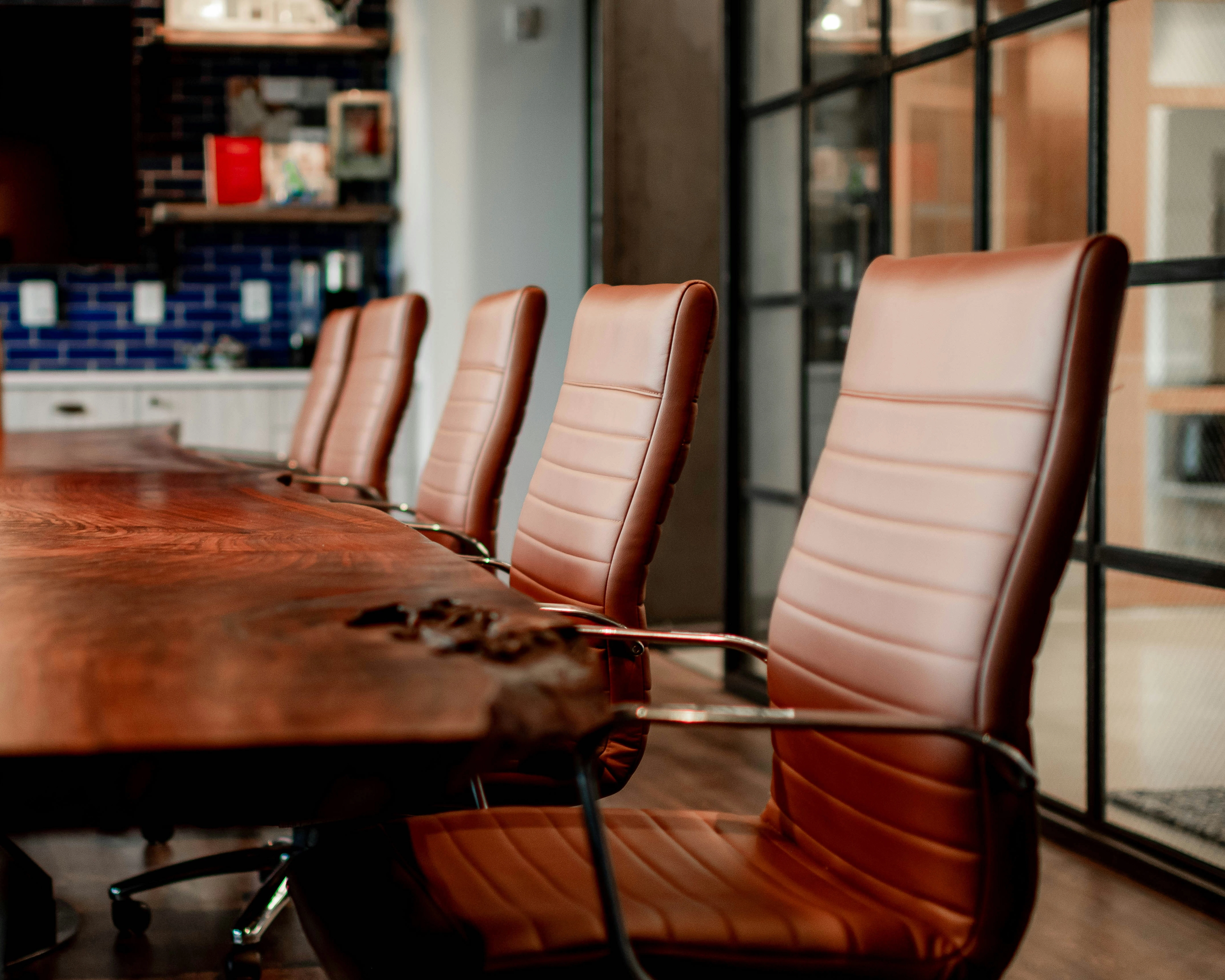 Empty boardroom chairs and meeting table